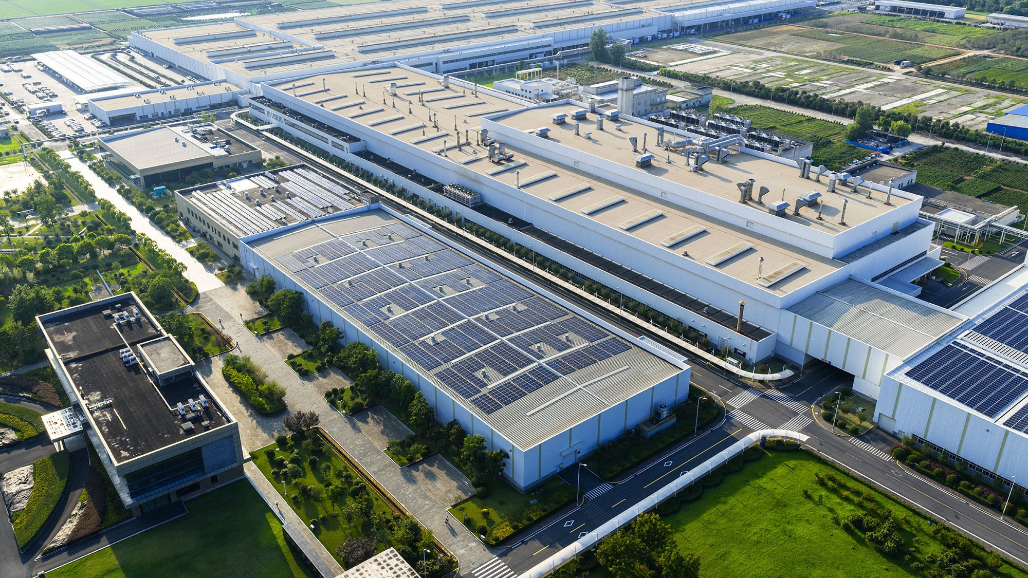 A collection of large rectangular data center buildings seen from above
