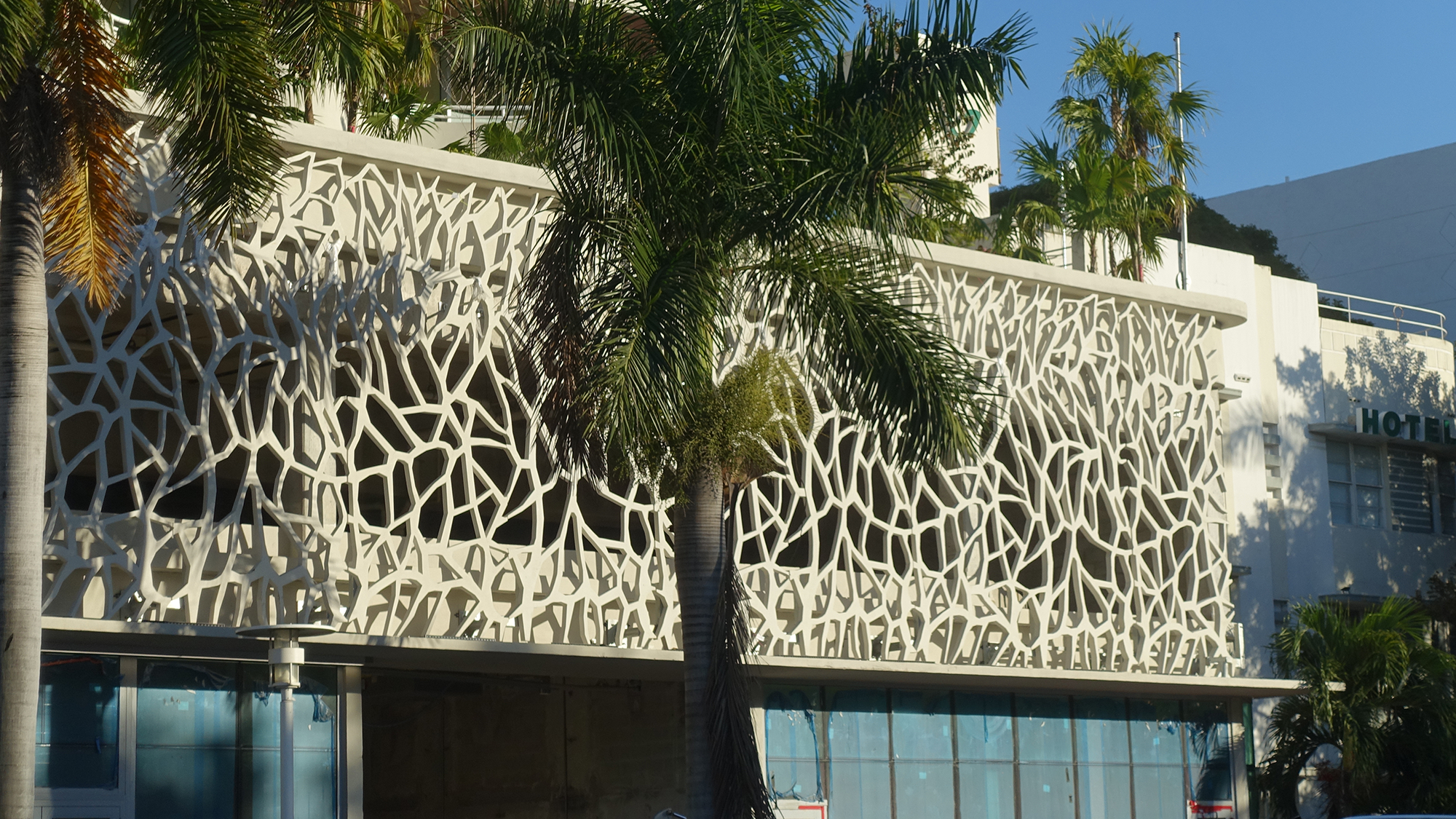 An ornate concrete facade of a multi-story hotel