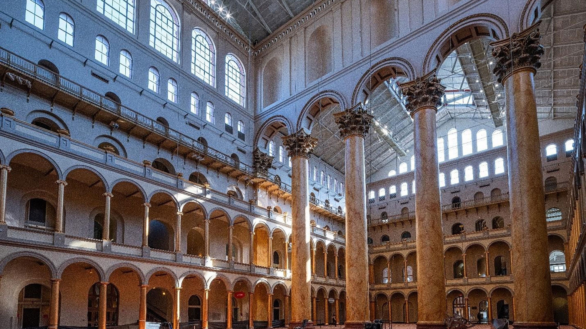 The Great Hall at the National Building Museum, containing massive Corinthian columns and a fountain.