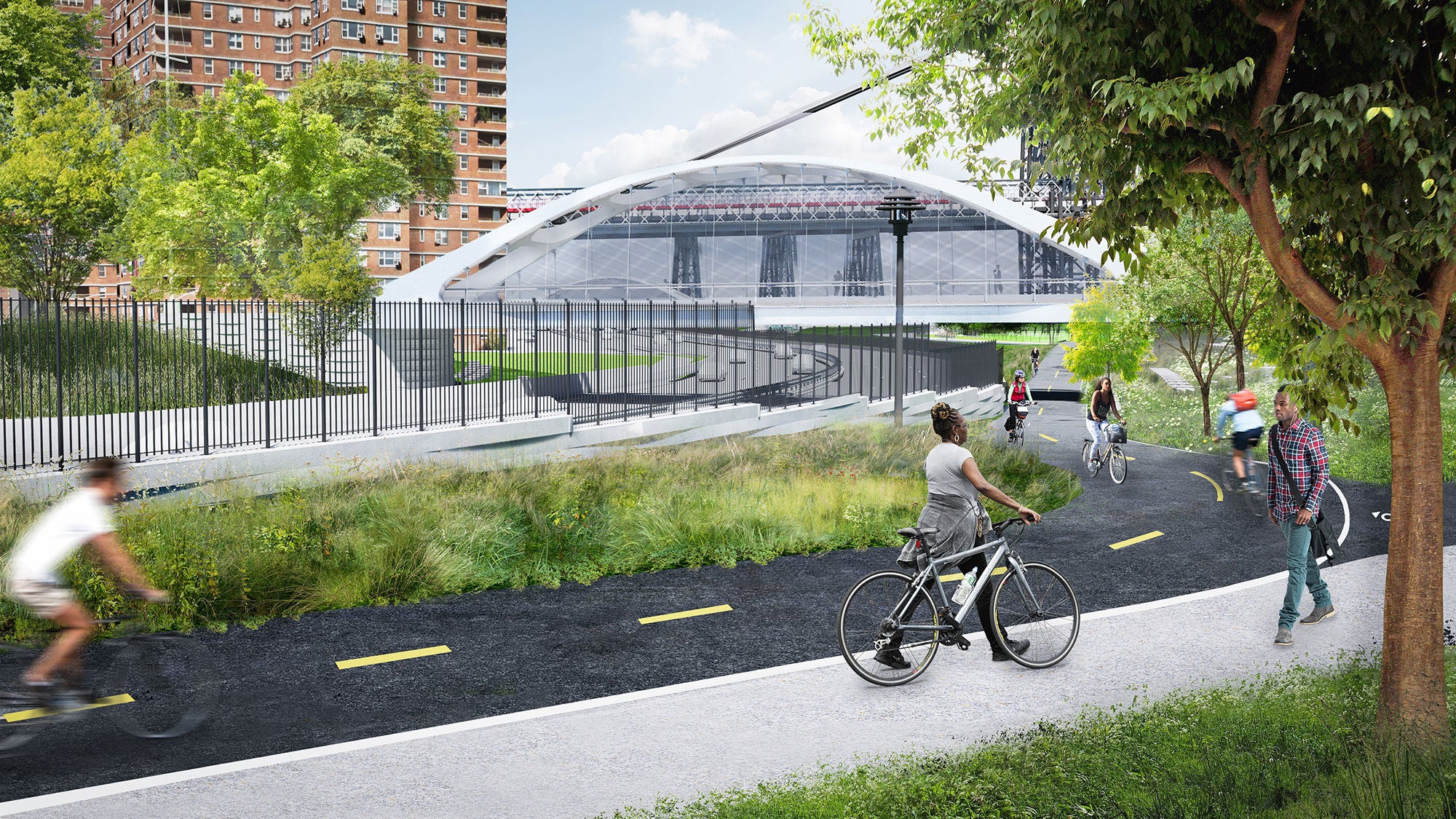 Cyclists on a paved greenway path within the East Side Coastal Resiliency Project in New York City. 