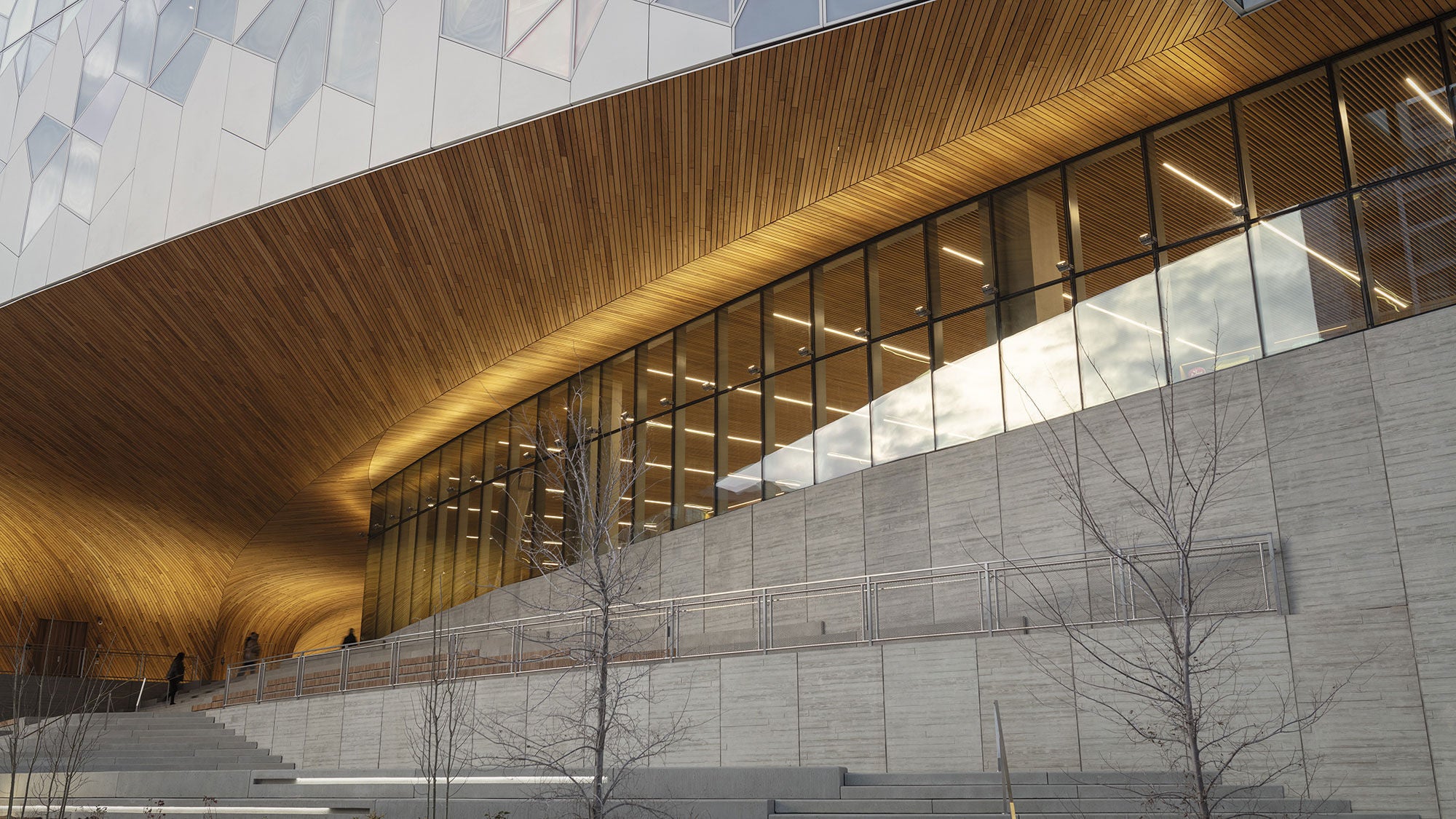 Amrize precast concrete steps and textured wall leading up to the main entrance of the Calgary Central library.