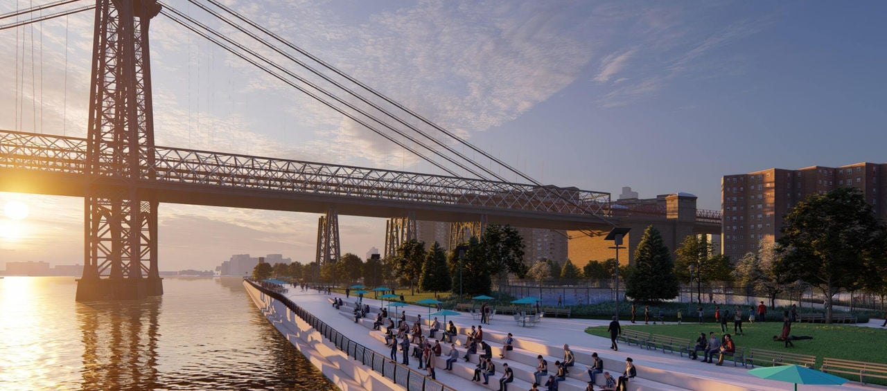 People enjoying the sunset from newly constructed steps in a park near the Brooklyn Bridge