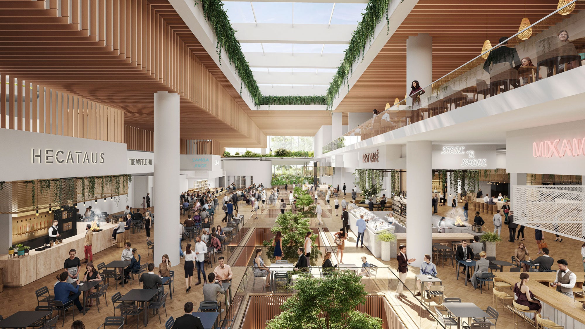 Modern, spacious food court with wood accents, greenery, and natural light from skylights. People dine and socialize at tables, creating a lively atmosphere.