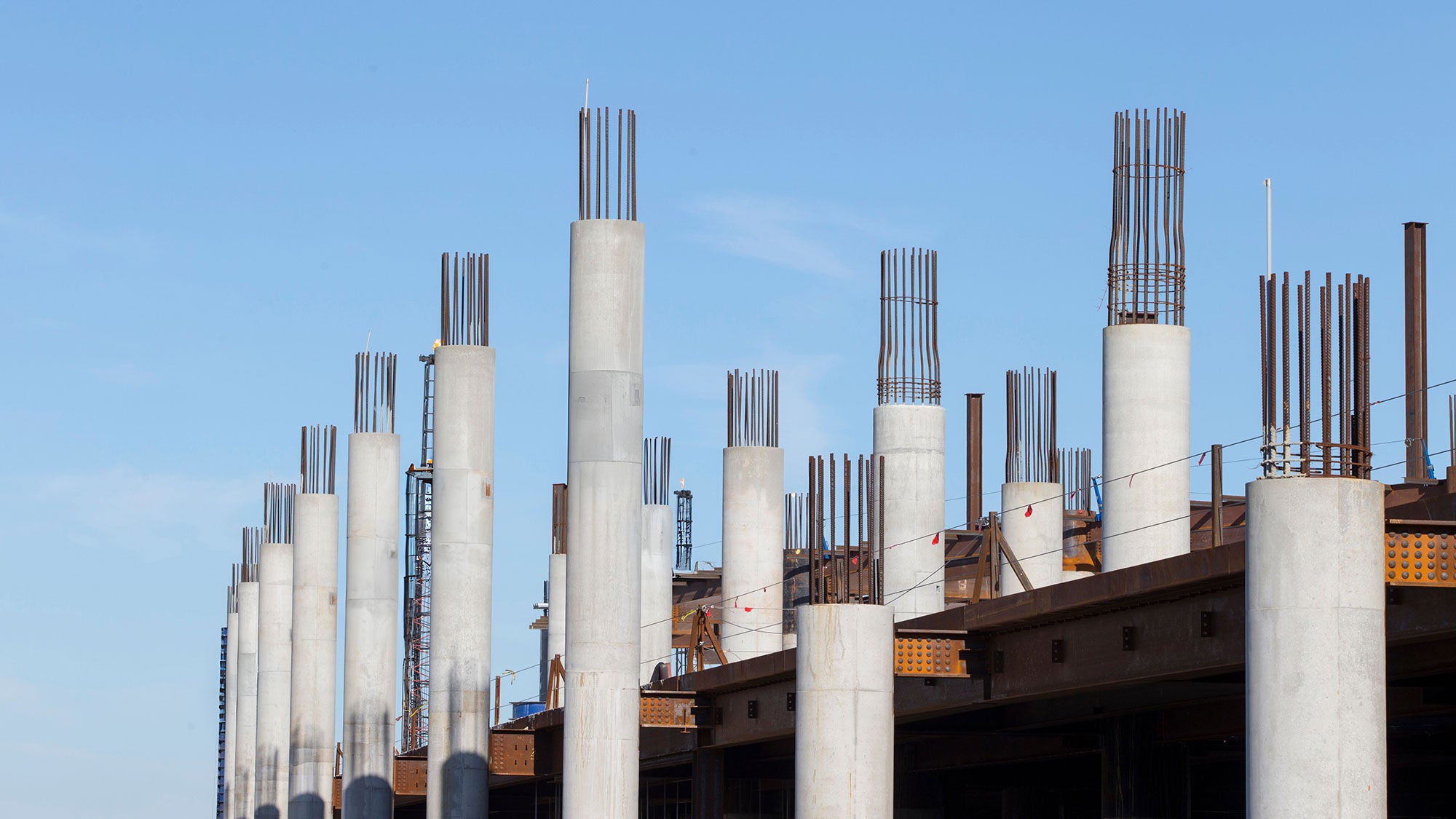 A collection of numerous building pillars under construction